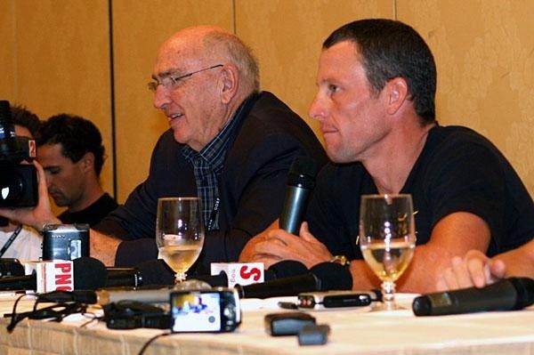 Lance Armstrong fields questions with Don Caitlin looking on next to him