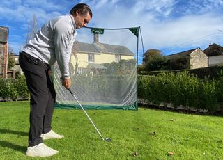 Photo of Joe Fergsuon hitting into Forb Golf net