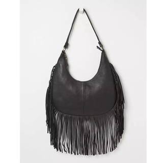 tried and tested gifts: black leather medium handbag with long tassel detail around the edge