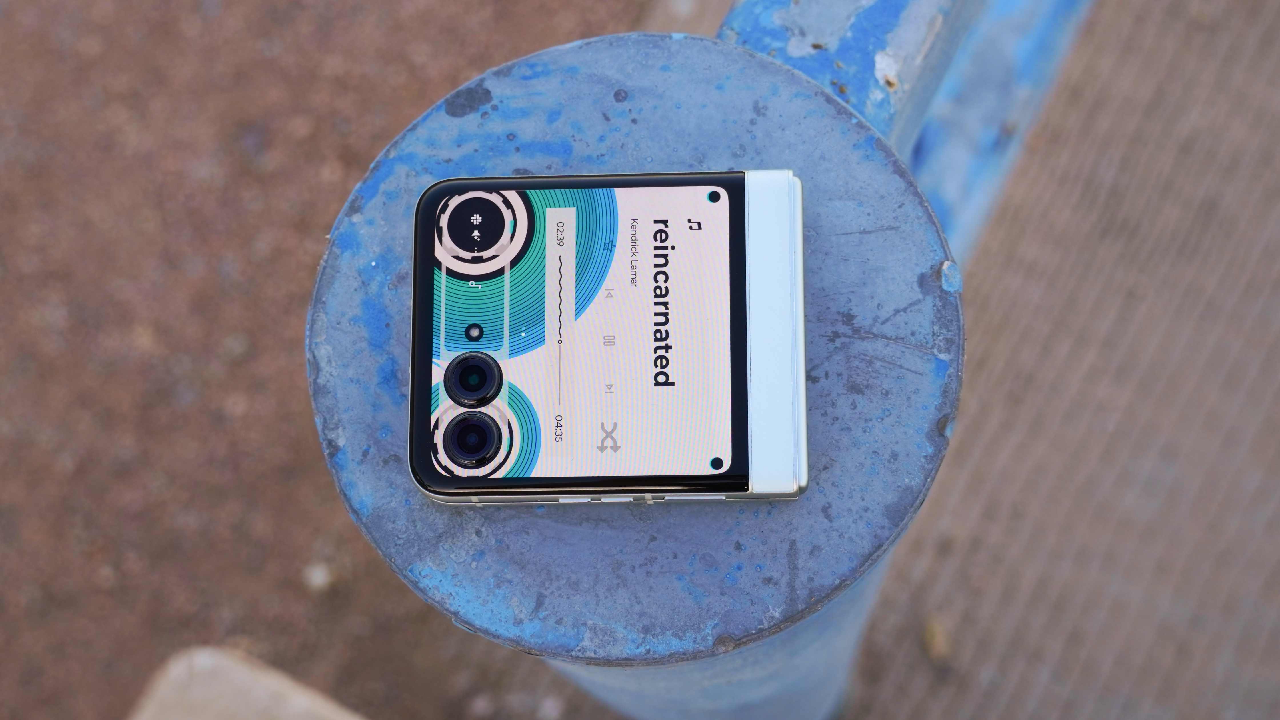 The Motorola Razr 2025 showing the tape music player interface on a blue post.