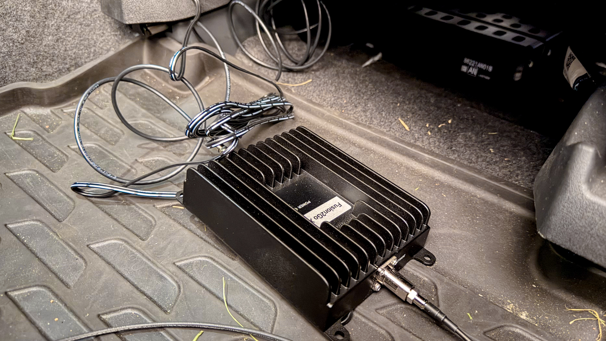 SureCall Fusion2Go XR booster box inside of car.