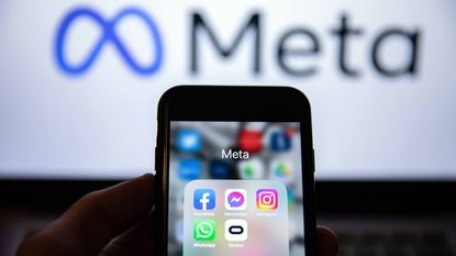 person looking at several apps owned by Meta Platforms on smartphone