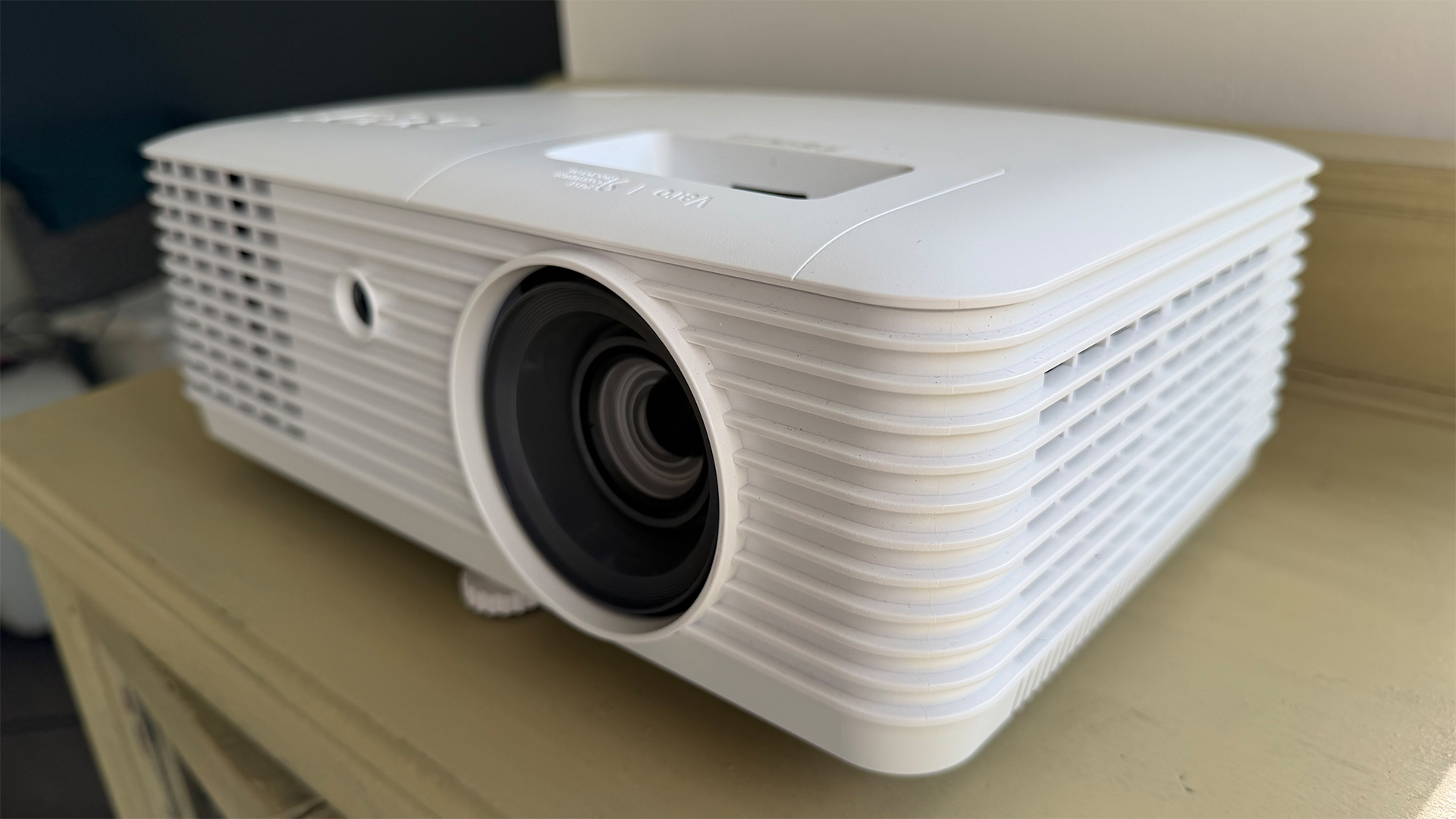Acer Vero HL6810ATV home cinema projector on wooden furniture