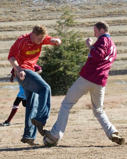 Prince Harry and Prince William play an annual Christmas Eve game of soccer.