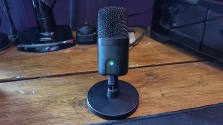The Amazon Basics USB condenser microphone on a desk