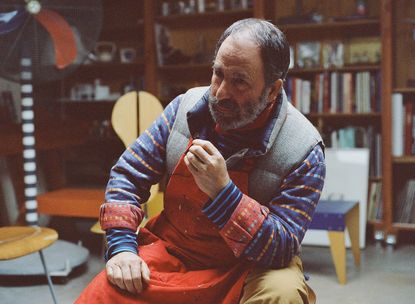 A close up portrait of Peter Shire photographed in his studio.