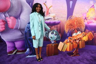 ayo edebiri at the inside out 2 premiere in a bottega veneta shorts suit