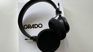 Grado GW100x headphones on top of branded box