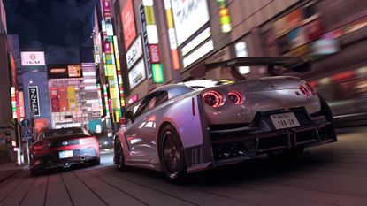Forza Horizon 6 gameplay shows cars racing down the tight city streets of Tokyo in Japan at night