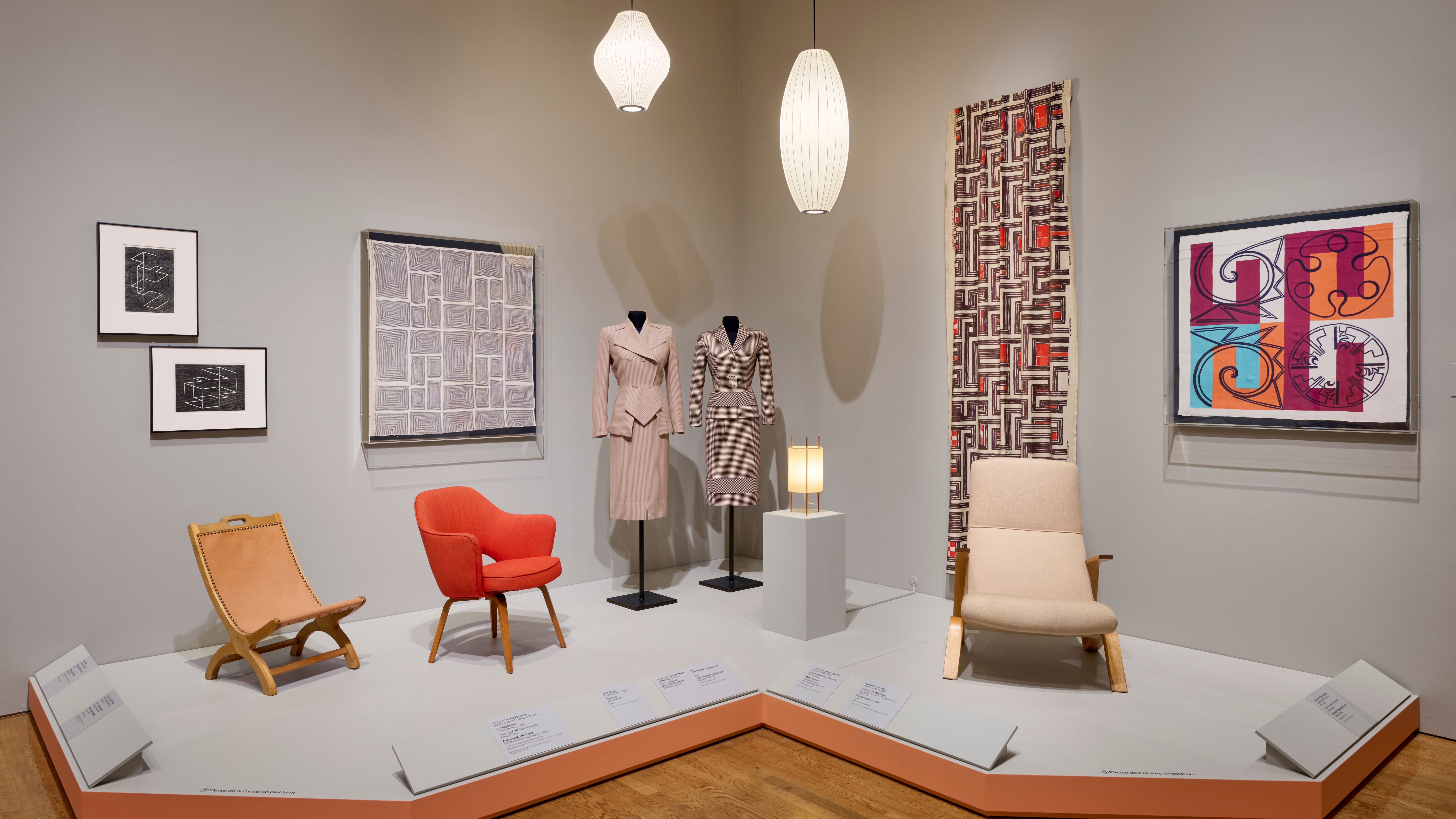 furniture and artworks in grey exhibition space