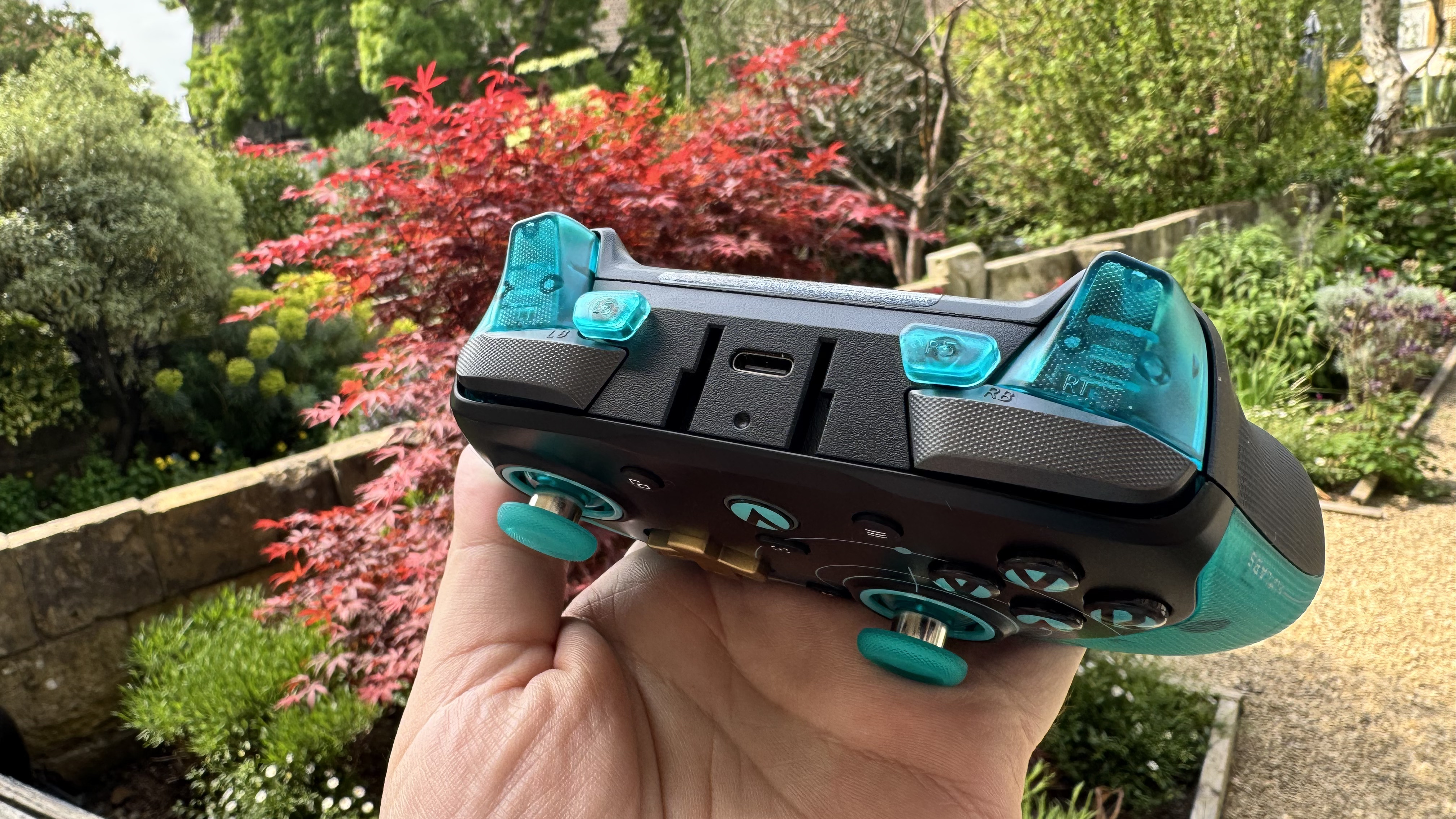 The GameSir G7 Pro 8K Aimlabs Edition, showing off the top buttons