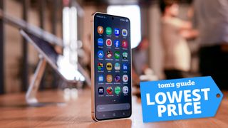 A Samsung Galaxy S25 Ultra handset standing upright on a desk with 'Lowest Price' badge overlaid