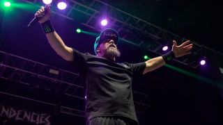 Mike Muir strikes a pose on stage