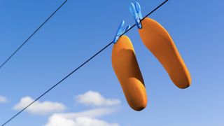 Running shoe insoles on a washing line