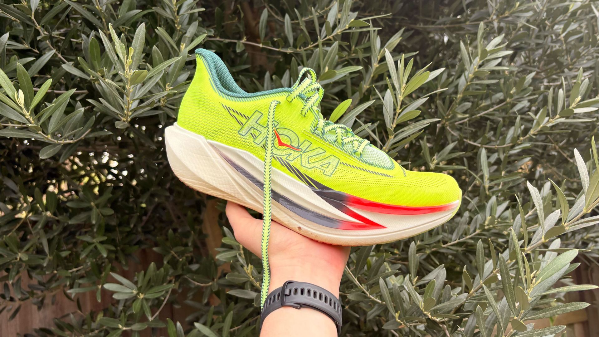 Grace Walsh holding Hoka Cielo X 1 3 running shoe for women