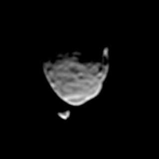 This view of the Martian moons Phobos and Deimos comes from a set of photos taken by NASA's Mars rover Curiosity on Aug. 1, 2013, as Phobos (the larger one) passed in front of Deimos from Curiosity's perspective.