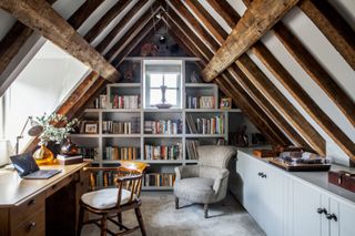 office in the attic with built in shelving and turntable