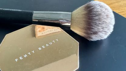 fenty beauty powder bronzer and brush close up