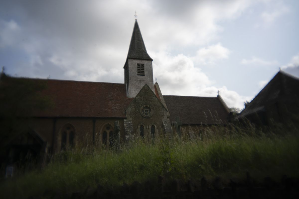 The exterior of an old Anglican church in the UK
