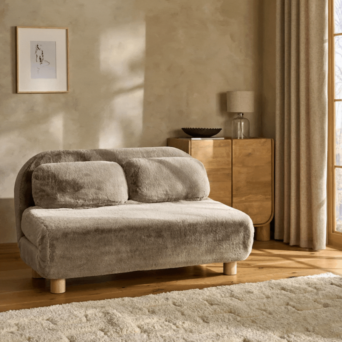 A fuzzy brown sofa bed