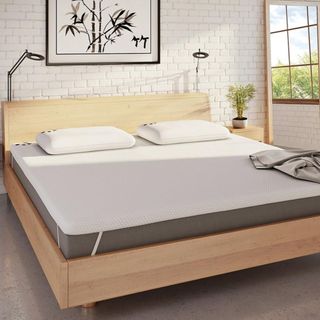 Panda mattress topper on wooden bed