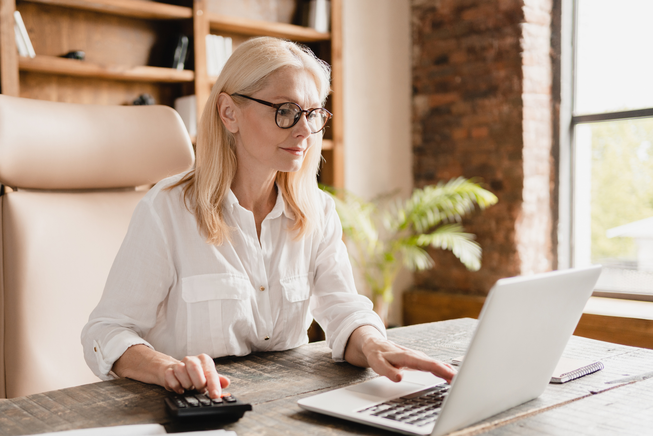 Older woman at laptops