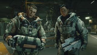 Two astronauts in sturdy gray spacesuits greet the player