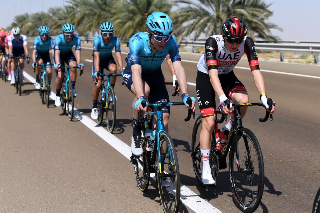 MADINAT ZAYED UNITED ARAB EMIRATES FEBRUARY 20 LR David De La Cruz Melgarejo of Spain and Team Astana Qazaqstan and Tadej Pogacar of Slovenia and UAE Team Emirates compete during the 4th UAE Tour 2022 Stage 1 a 184km stage from Madinat Zayed to Madinat Zayed UAETour WorldTour on February 20 2022 in Madinat Zayed United Arab Emirates Photo by Tim de WaeleGetty Images