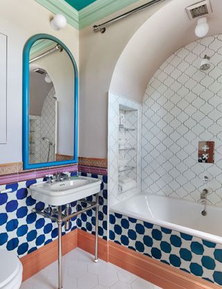 Antique bathroom with colorful tiles