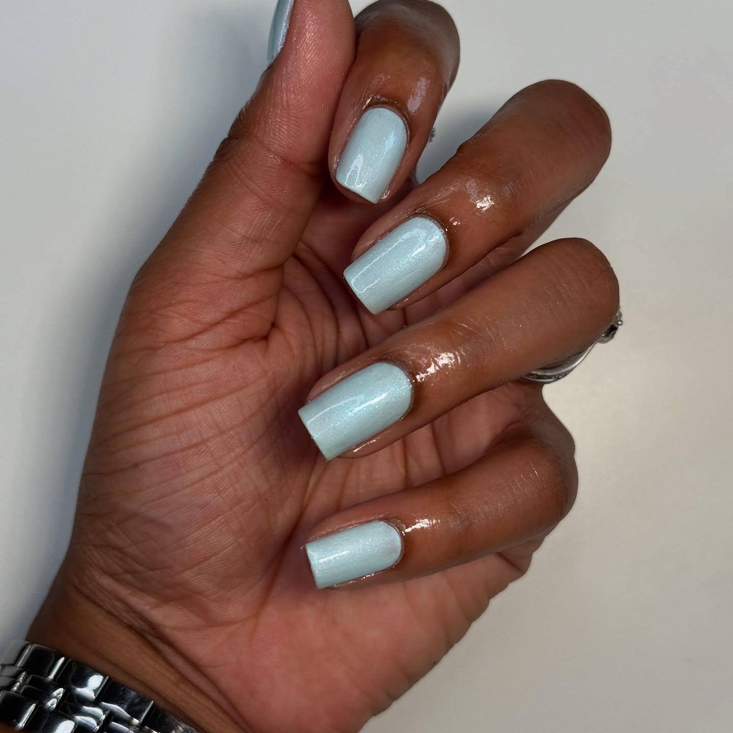 A shimmery, icy blue manicure.