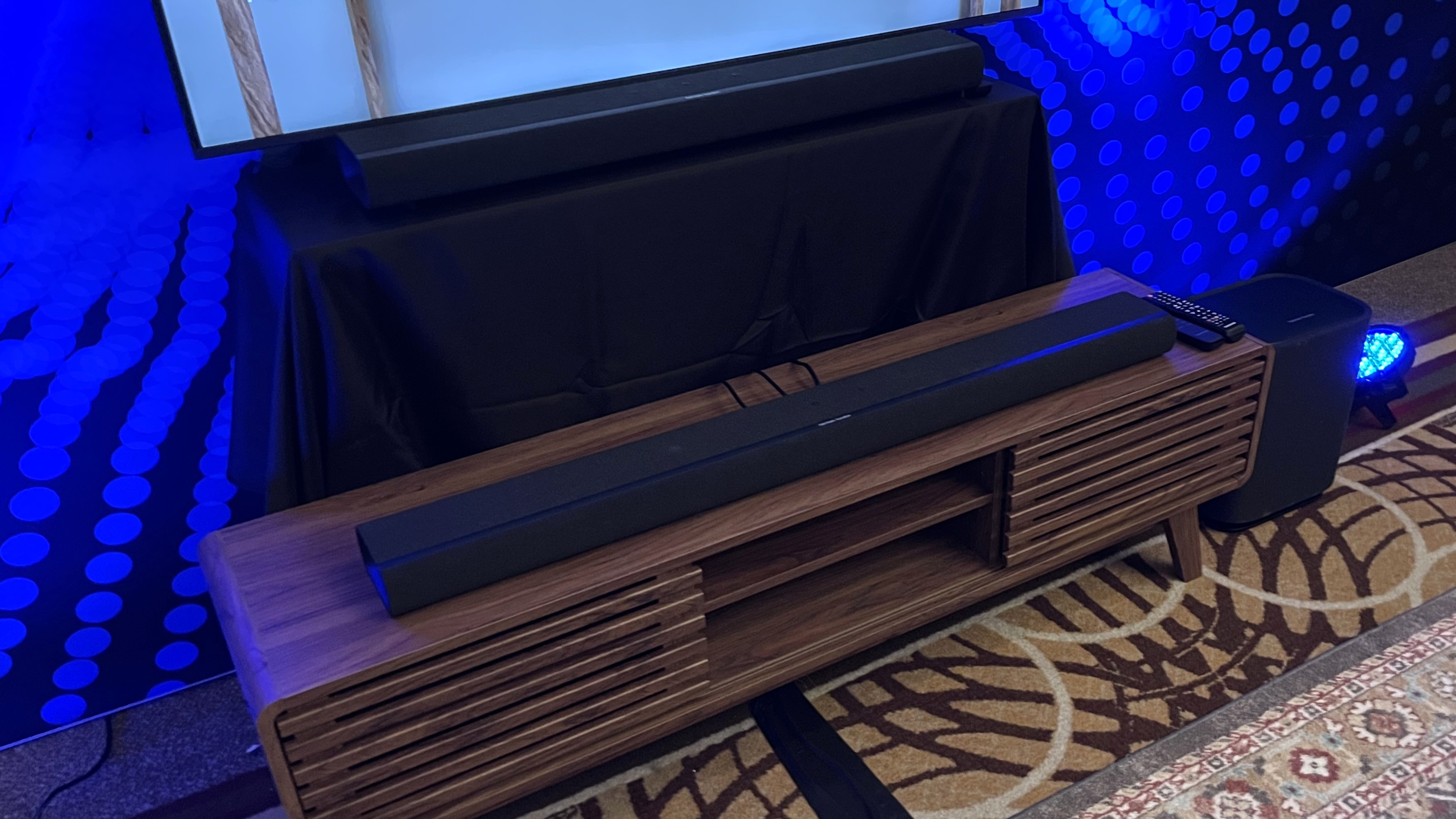 Harman Kardon Enchant 1100 and 900 soundbars on shelf