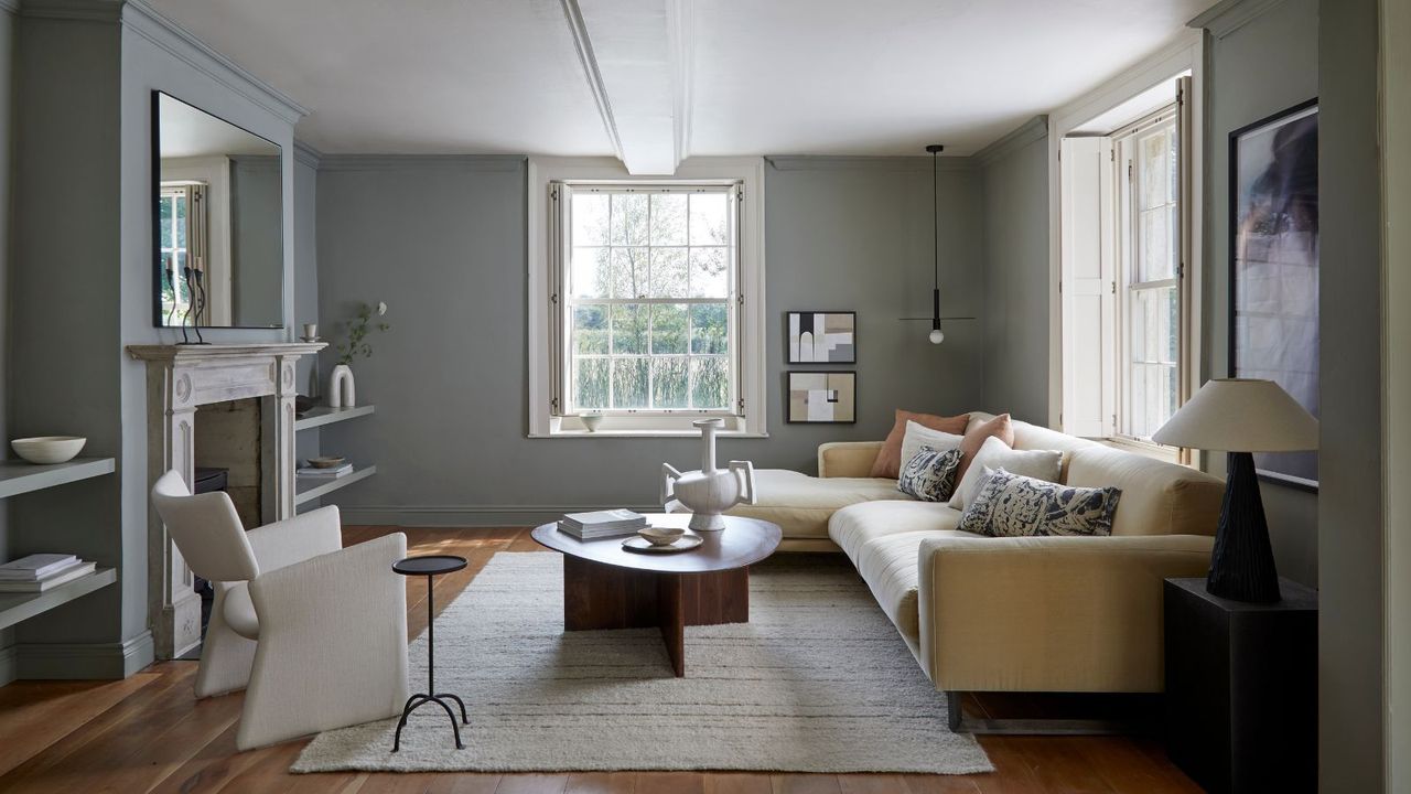 living room with corner sofa and armchair and coffee table and rug