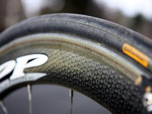 Zipp's surface dimples have become a hallmark of the brand, supposedly lowering wind resistance by creating a drag-reducing boundary layer over the surface.