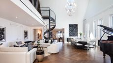 Succession apartment foyer with black and white furnishings