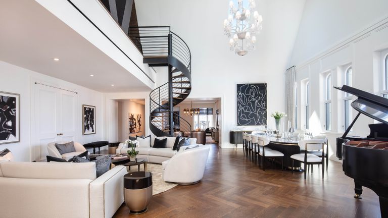 Succession apartment foyer with black and white furnishings