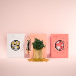 3 washing machines against a pink background with green leaves