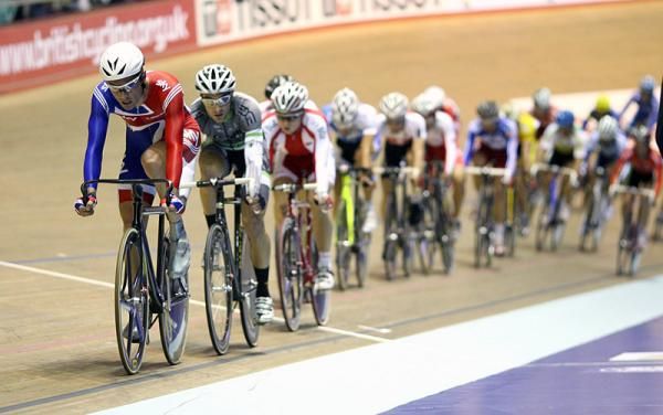 Chris Newton (Great Britain) heads the field in a men's points race qualifying heat.