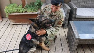 Military working dog Akim has been adopted by his former handler, Senior Airmen Jenna.