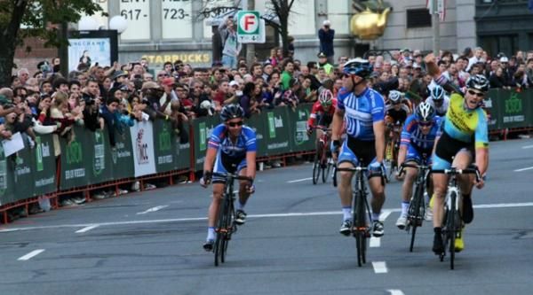 Luke Keough (Team Mountain Khakis/SmartStop) raises his arm in victory.