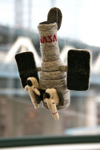 Jen Scheer of Merritt Island, Fla., recreated the Hubble Space Telescope and two spacewalkers in felt form as her entry for NASA's Space Craft Contest with the online craft site Etsy. The entry was photographed during a March 18 event at Etsy Labs in New
