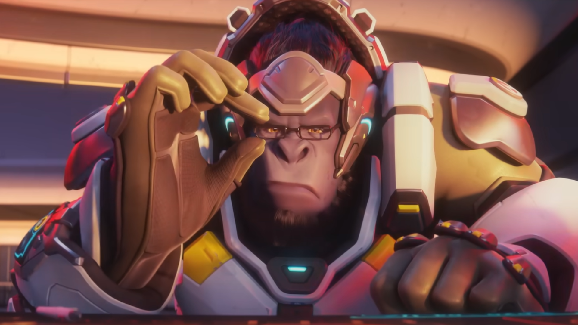 Winston adjusting his glasses while looking at a screen