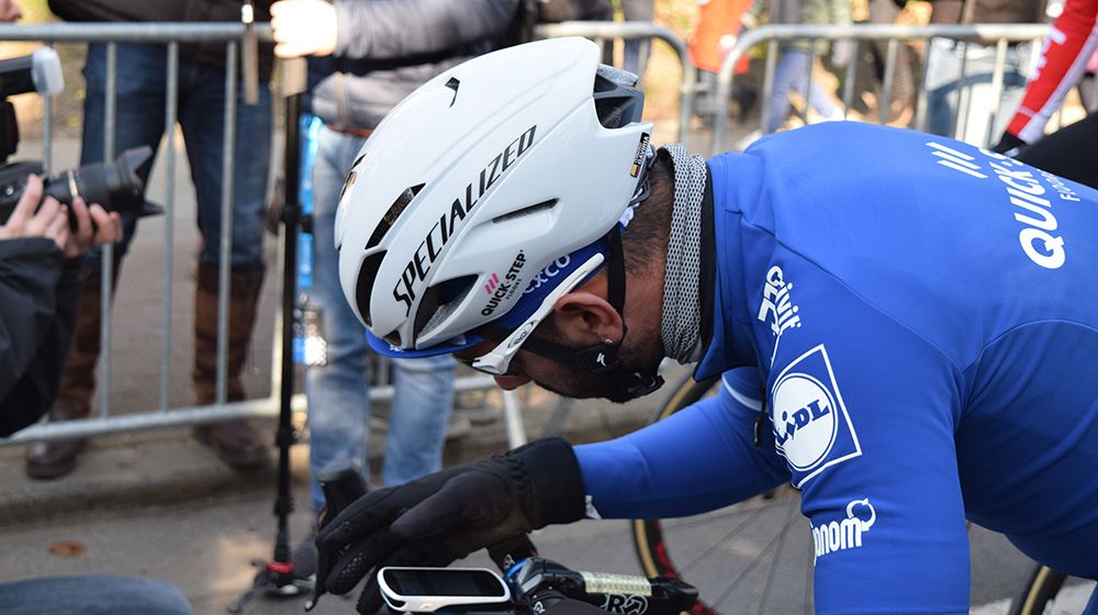 Fernando Gaviria (Quick-Step Floors) sets up his Garmin Edge 1030 computer ahead of Omloop Het Nieuwsblad
