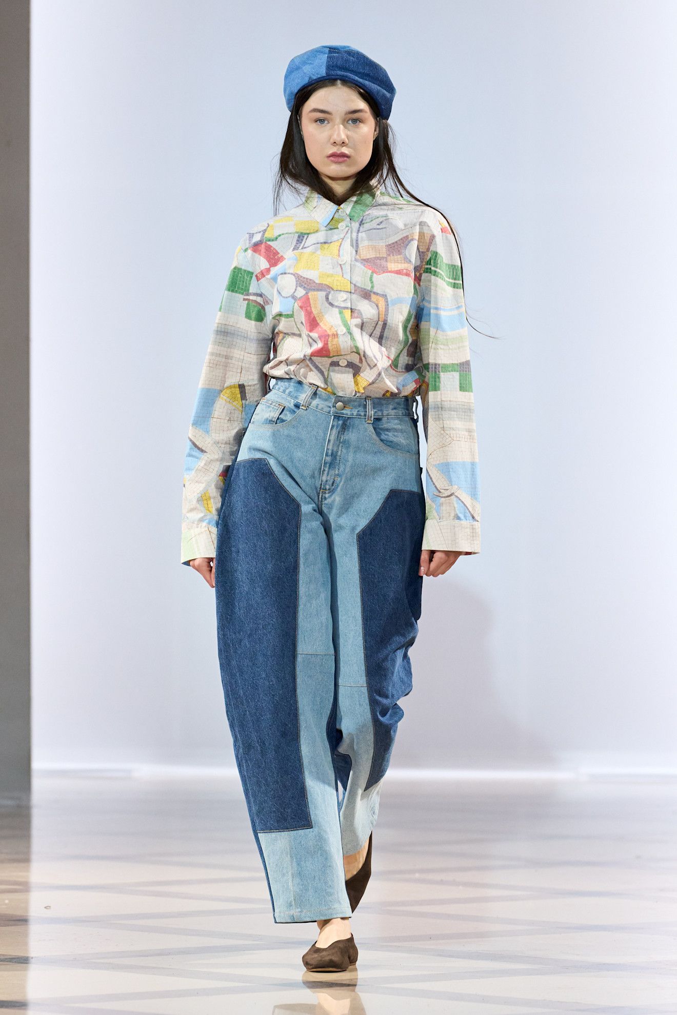 Model on the runway wearing two-tone jeans controversial denim trend.