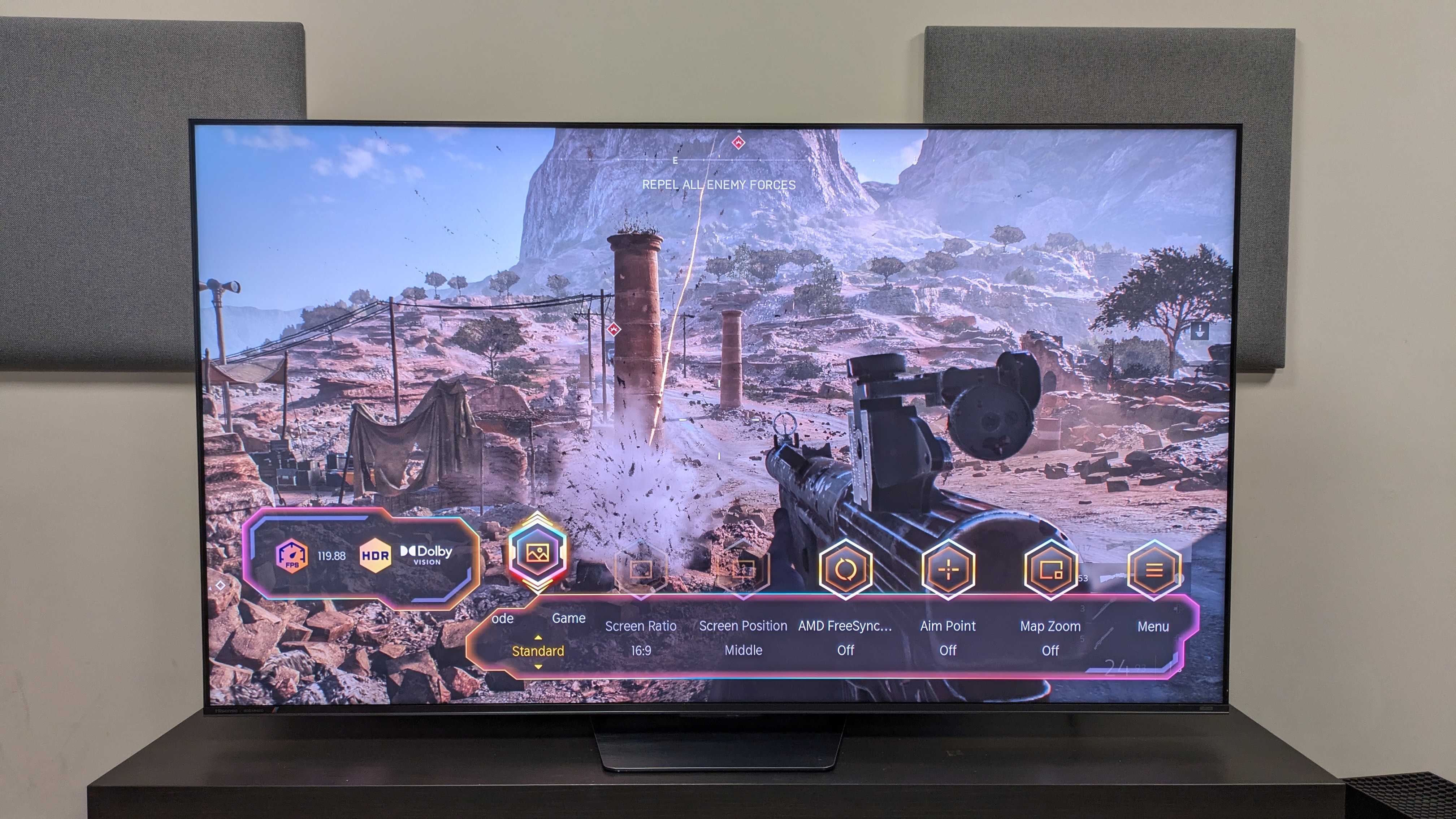 Hisense UR8 with shot from Battlefield V on screen, with game menu along the bottom
