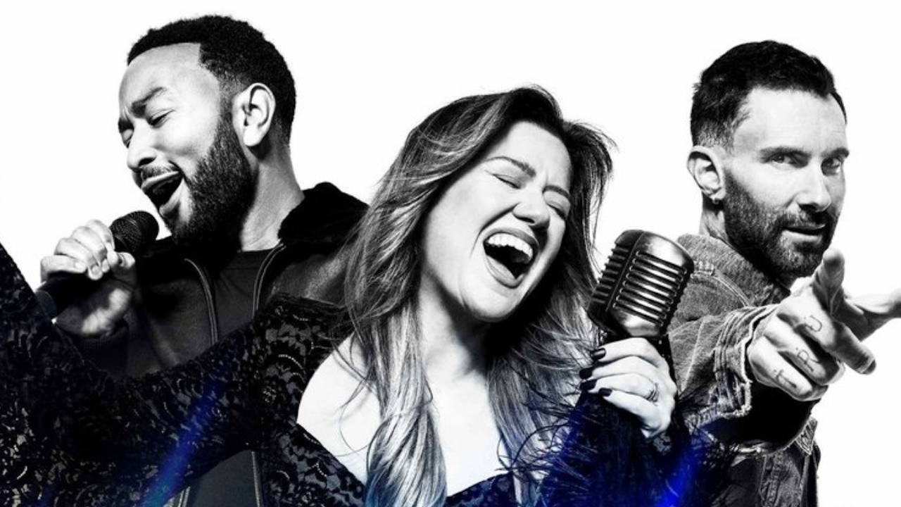 Black and white images of The Voice Season 29 coaches are shown - John Legend, Kelly Clarkson and Adam Levine.