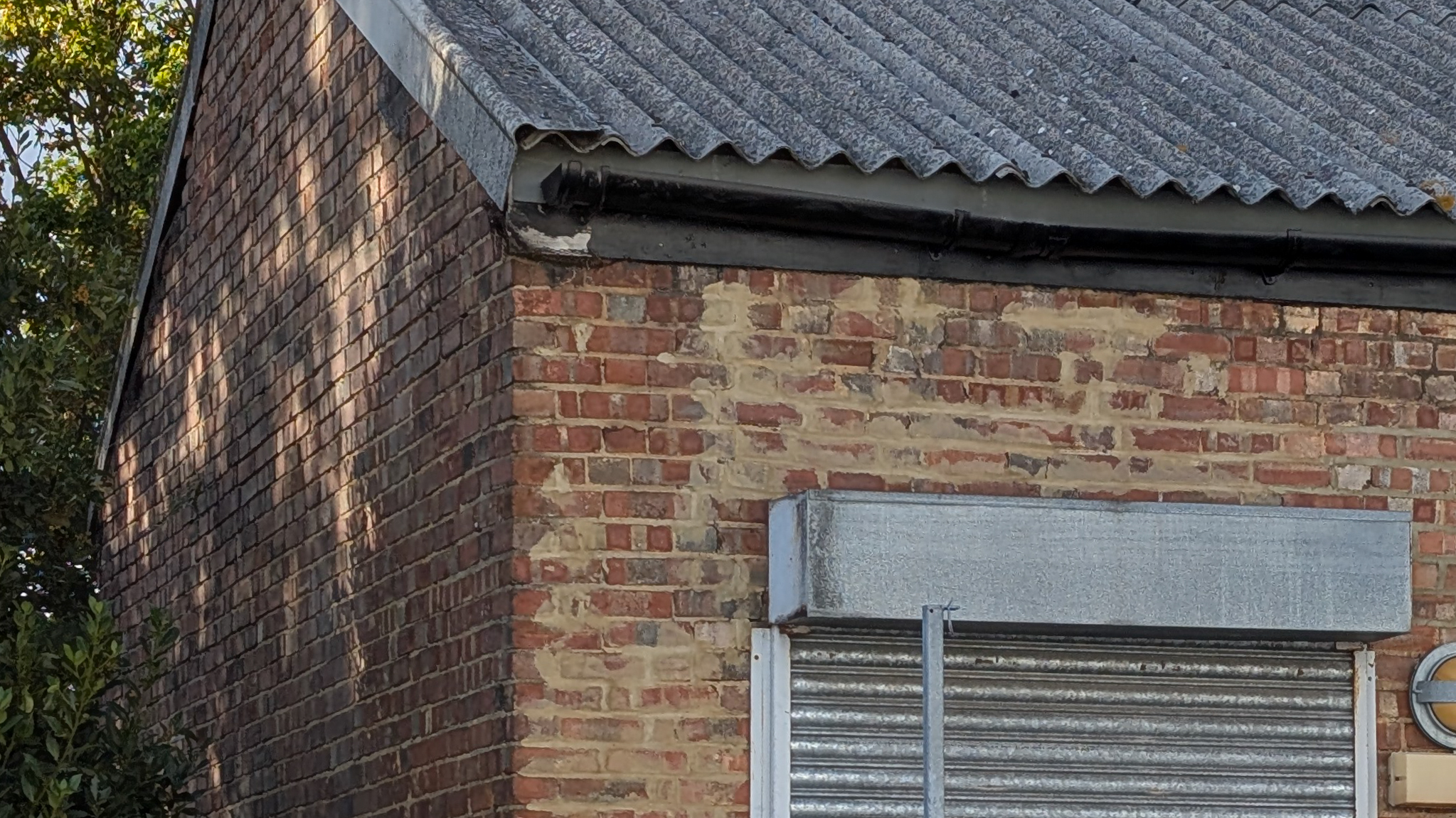 Brick warehouse with a metal shutter