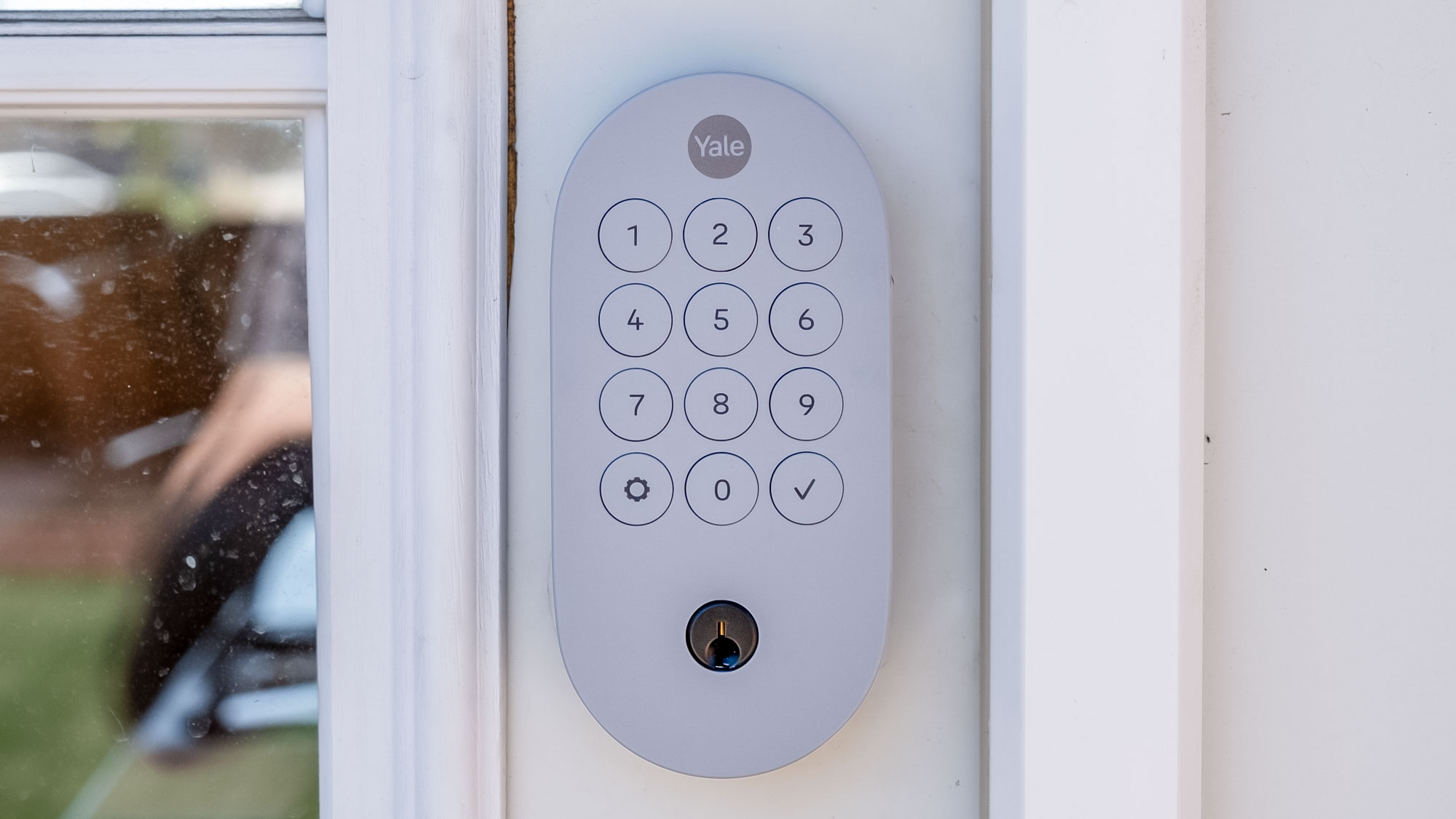 Showing the front of a Yale Smart Lock with Matter installed on an exterior door