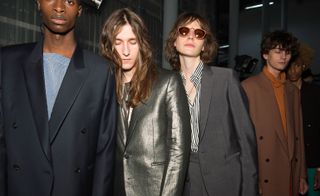 Male models with long hair wearing Paul Smith collection