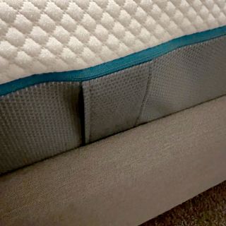 The edge of the Simba Hybrid Pro mattress showing a side handle