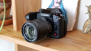 Panasonic Lumix GH7 camera with lens attached on a shelf